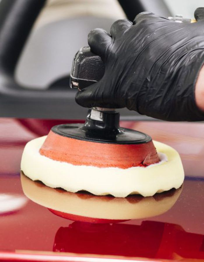 person-cleaning-car